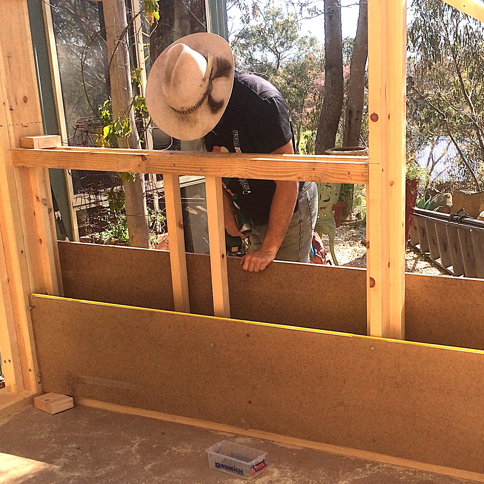 Timber wall framing with vertical keying battens and temporary shuttering being fitted